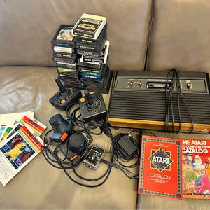 Atari 2600 1980–1982 Woodgrain Vintage Console + 24 games, controllers, manuals and accessories