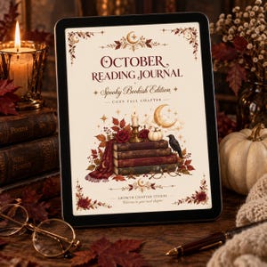 Può includere: Un tablet digitale che mostra la copertina di un diario di lettura di ottobre. Il design presenta una pila di libri, una candela, una zucca, un corvo e foglie autunnali con il testo Growth Chapter Studio nella parte inferiore.