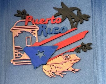 May include: A multi-colored 3D printed wall decoration featuring the text Puerto Rico in red and blue. It includes a depiction of a sentry box, a blue triangle with a star, a red stripe, a golden coqui frog, and black palm tree silhouettes.