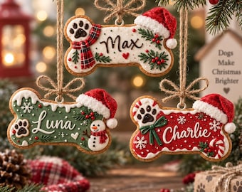 May include: Three bone-shaped Christmas ornaments hanging by twine. The top ornament is white with a plaid scarf, paw print, and the name Max. The bottom left is green with a snowman, paw print, and the name Luna. The bottom right is red with a candy cane, paw print, and the name Charlie. Each features a Santa hat.
