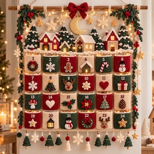 May include: A crocheted wall-hanging advent calendar featuring twenty-four numbered pockets in red, green, and cream. The top displays a winter village scene with houses, pine trees, a crescent moon, and stars, all illuminated by integrated warm string lights.