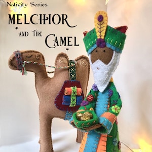 May include: A felt Christmas ornament pattern featuring Melchior, one of the three wise men, riding a camel. The pattern includes instructions for making a free-standing ornament. The text on the image reads "Nativity Series Melchior and the Camel An Original, Hand Embroidered, Free Standing Ornament Pattern By Clara Batton Smith".