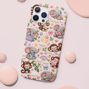 May include: A light pink smartphone case featuring a repeating pattern of crocheted-style illustrations including grey elephants, brown monkeys, yellow crescent moons, rainbows, white clouds, small flowers, and blue bows on a soft pastel background.