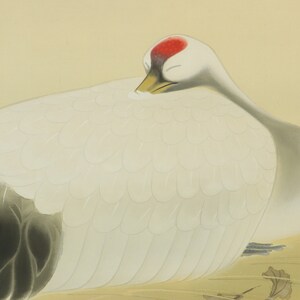 May include: A white crane with a red crown on its head is resting with its head tucked under its wing. The crane is painted in a traditional Japanese style on a light yellow background.