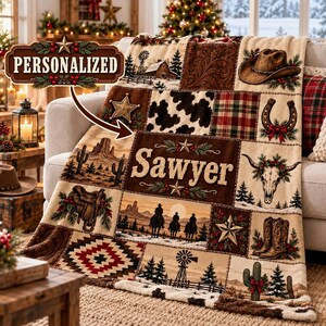 May include: A plush throw blanket featuring a patchwork design with Western and Christmas themes. The pattern includes a cowboy hat, horseshoe, cactus, saddle, windmill, and a steer skull, with the name Sawyer printed in the center.