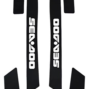 May include: A set of six black adhesive decals for a personal watercraft. The two long, vertical strips feature the white text SEA-DOO in a bold, sans-serif font. The remaining four pieces are solid black shapes with angled edges.