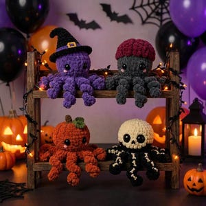May include: Four crocheted octopus plushies displayed on a wooden shelf. The top row features a purple octopus wearing a black witch hat and a dark gray octopus with a maroon cap. The bottom row shows an orange pumpkin-themed octopus and a skull-themed octopus.