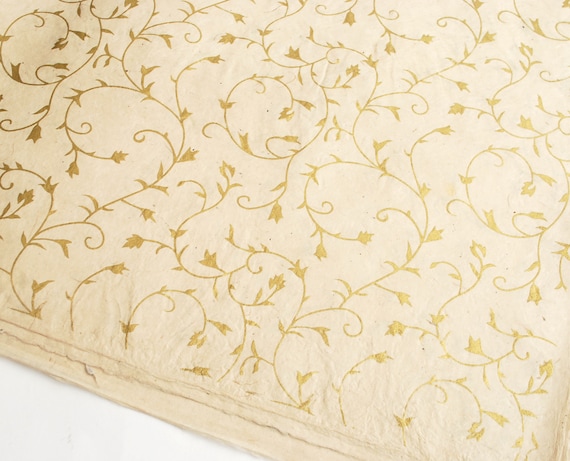 Gold Stars on Hand made and Fair Trade Paper Aqua Lokta Wrapping Paper