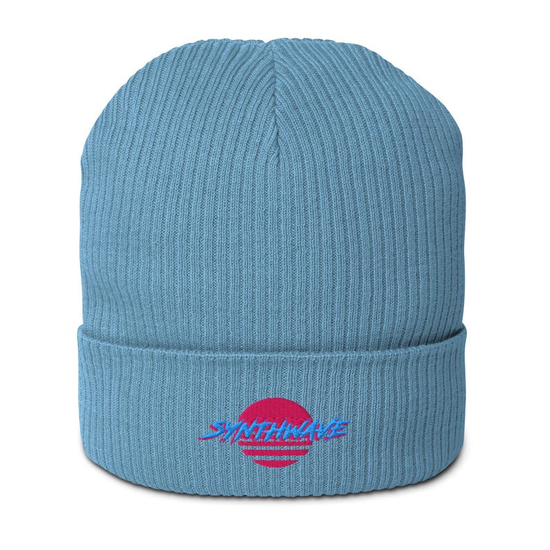 Classic ribbed beanie. Synthwave embroidered in retro front in bright blue with hot pink shadow over a sunset in hot pink.
6 colours available.
Oxford Navy
Black
Light Avio Blue
Light Grey
Leaf Green
Mustard Yellow.
Light Avio Blue shown.
