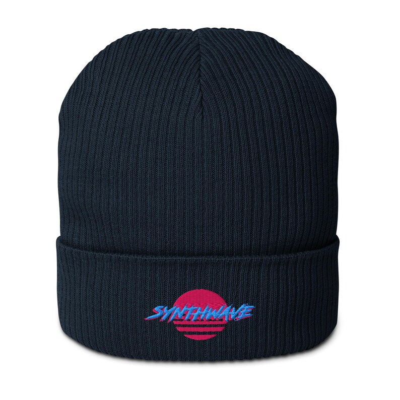Classic organic cotton ribbed beanie. Synthwave in retro front in bright blue with hot pink shadow over a sunset in hot pink.
6 colours available.
Oxford Navy
Black
Light Avio Blue
Light Grey
Leaf Green
Mustard Yellow.
Oxford navy shown.