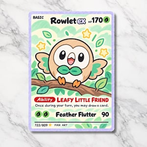 May include: A rectangular trading card featuring a cartoon Rowlet ex character with 170 HP. The illustration shows a brown owl perched on a branch with green leaves and yellow stars. Text includes Rowlet ex, Leafy Little Friend, and Feather Flutter.