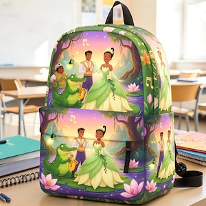 May include: A backpack featuring a colorful print of a princess in a green gown, a prince in a white suit, and a green alligator playing a saxophone. The scene includes musical notes, pink water lilies, and a sunset background on a green base.