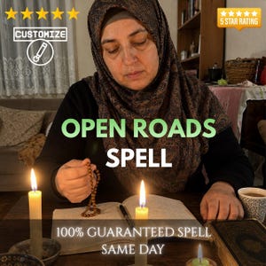May include: A person wearing a dark patterned headscarf and black long-sleeved shirt holds a string of brown beads over an open book. Two lit candles stand on the table, with text reading OPEN ROADS SPELL and 100% GUARANTEED SPELL SAME DAY.