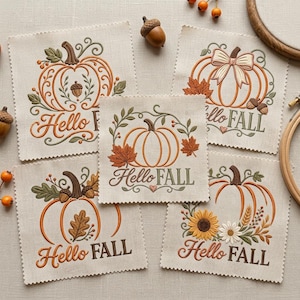 May include: Five square fabric patches featuring machine embroidery designs of pumpkins, autumn leaves, acorns, sunflowers, and wheat. Each patch includes the text Hello FALL in various fonts and decorative styles, stitched in orange, brown, and green.