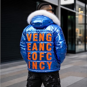 May include: A metallic blue puffer jacket with a hood featuring a white faux fur trim. The back of the jacket displays the orange text VENG EANG EOFC INCY in a block font. The jacket has a quilted design and is worn with black cargo pants.