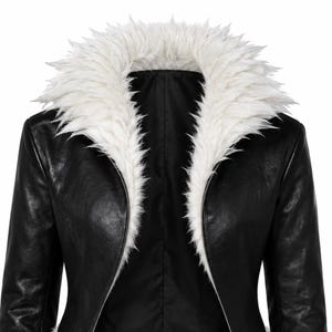 May include: A black jacket featuring a prominent white faux fur collar. The jacket has a smooth, dark finish and long sleeves, with the white fur extending down the front opening, creating a sharp contrast against the black material of the garment.