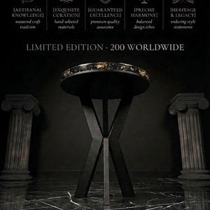 May include: A round side table with a black top featuring gold-colored flecks and a black X-shaped base. Text above reads: ARTISANAL KNOWLEDGE, EXQUISITE CURATION, GUARANTEED EXCELLENCE, PRECISE HARMONY, HERITAGE & LEGACY, and LIMITED EDITION 200 WORLDWIDE.