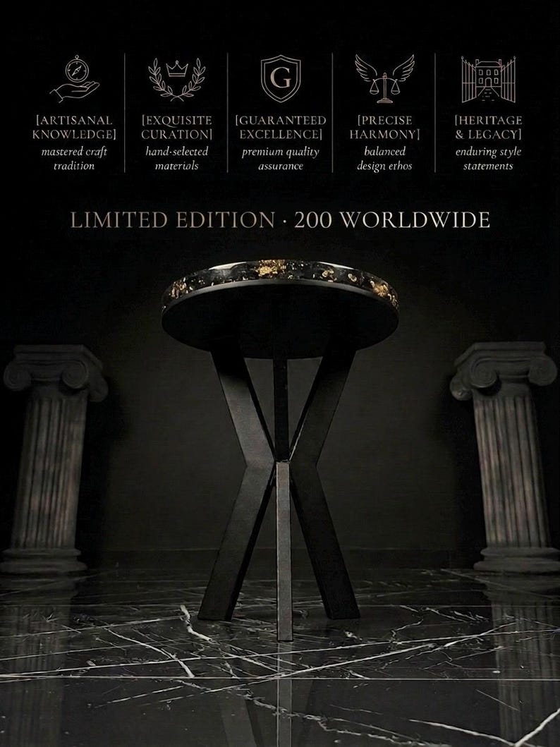 May include: A round side table with a black top featuring gold-colored flecks and a black X-shaped base. Text above reads: ARTISANAL KNOWLEDGE, EXQUISITE CURATION, GUARANTEED EXCELLENCE, PRECISE HARMONY, HERITAGE & LEGACY, and LIMITED EDITION 200 WORLDWIDE.