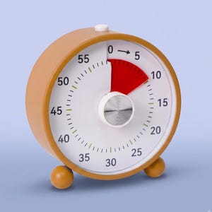 May include: A round analog visual timer with a mustard yellow casing and two small spherical feet. The white face features black numbers from 0 to 55, a central silver knob, and a red wedge indicating the elapsed time between 0 and 5 minutes.