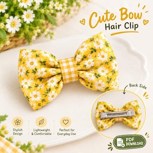 May include: A yellow fabric hair clip featuring a white daisy pattern with green leaves and a yellow and white gingham center knot. The text Cute Bow Hair Clip is visible, along with a circular inset showing the metal clip on the back side.