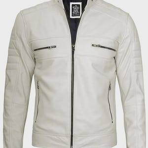 May include: A light grey leather jacket featuring a stand-up collar with a snap button, a central black zip, and two horizontal zipped chest pockets. The shoulders and sleeves have quilted panel detailing, and the interior is black.
