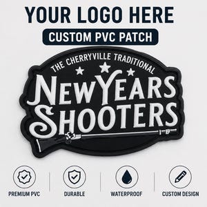 May include: A black and white custom PVC patch featuring the text THE CHERRYVILLE TRADITIONAL NEW YEARS SHOOTERS with three stars above the text and a rifle graphic below the lettering. The patch has a raised, molded design with a black background.