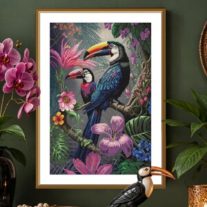 May include: A framed cross-stitch artwork depicting two toucans perched on a branch amidst vibrant pink and purple tropical flowers and lush green foliage. The toucans have black feathers, white chests, and large, colorful yellow, orange, and black beaks.