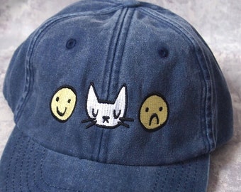 Happy sad cat face embroidered vintage style blue baseball cap