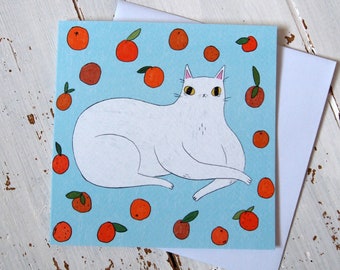 White cat with oranges illustrated greetings card