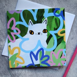 White cat with flowers blank greetings card