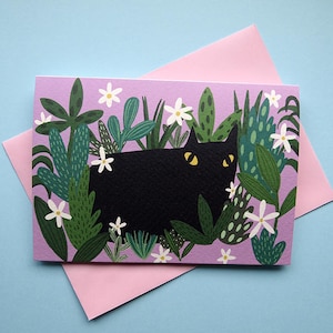 Biglietto di auguri con gatto nero e piante