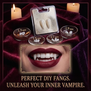 May include: A set of white vampire fangs in a clear plastic blister pack, accompanied by four small circular containers holding adhesive pellets labelled 1.3 mm, 1.5 mm, 1.7 mm, and 1.9 mm. An inset shows a mouth with fangs. Text reads: PERFECT DIY FANGS. UNLEASH YOUR INNER VAMPIRE.