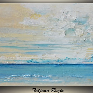 May include: Abstract painting of a seascape with a blue ocean and a white and yellow sky. The painting has a textured surface and is signed "Tatijana Ruzin" in the bottom right corner.