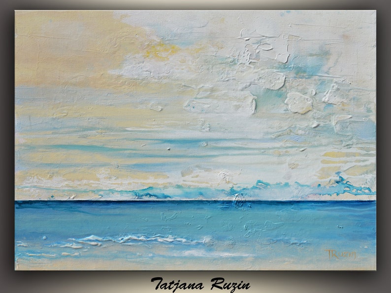 May include: Abstract painting of a seascape with a blue ocean and a white and yellow sky. The painting has a textured surface and is signed "Tatijana Ruzin" in the bottom right corner.