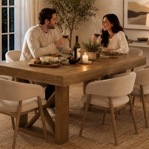 May include: A rectangular wooden dining table with a thick top and sturdy base, surrounded by four upholstered chairs with light beige fabric seats and wooden legs, arranged on a textured woven rug in a dining room setting.