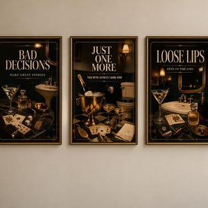 May include: A set of three framed wall art prints featuring dark, moody bathroom scenes with gold accents. The prints display the text BAD DECISIONS MAKE GREAT STORIES, JUST ONE MORE THEN WE'RE DEFINITELY GOING HOME, and LOOSE LIPS STAY IN THE LOO.