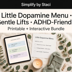 May include: A digital tablet and a printed paper sheet both titled Little Dopamine Menu, featuring Gentle Lifts tasks like 5-Min Stretch, Drink Water, and Deep Breathing. The scene includes a lit candle, green socks, and eucalyptus branches.