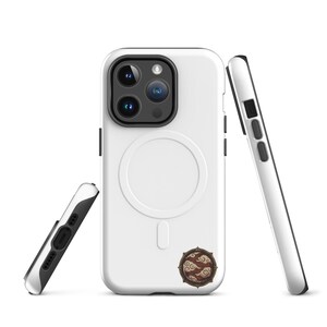 May include: A white smartphone case with a circular magnetic charging ring on the back and a small, round, brown emblem featuring a stylised cloud pattern near the bottom. The case has a black camera module cutout and black side buttons.