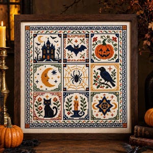 May include: A framed cross-stitch sampler featuring nine square panels with Halloween motifs including a haunted house, bat, pumpkin, crescent moon, spider web, raven, black cat, candle, and a star emblem, all bordered by a geometric pattern.