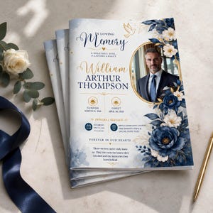 May include: A funeral program booklet featuring a portrait of a man in a suit, navy blue and white floral accents, and gold text. The cover reads In Loving Memory, William Arthur Thompson, with sunrise and sunset dates and service details.
