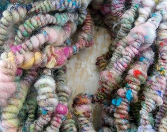 hand spun Art Yarn Super Coils Sunset over Fields Merino and Cotton.