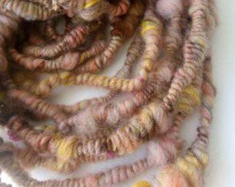 hand spun Art Yarn Super Coils Sunset over Fields Merino and Cotton.