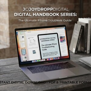 May include: A laptop displaying a digital document titled JOJOYDROPP DIGITAL HANDBOOK SERIES: The Ultimate iPhone Troubleshooting Guide. The screen shows a preview of the PDF pages, including text and icons, on a dark wooden desk with a notebook and pen.