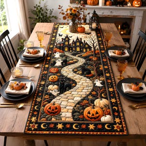 May include: A rectangular fabric table runner featuring a Halloween-themed print of a stone path leading to a dark house, surrounded by pumpkins, ghosts, and black cats, with a border of stars and crescent moons on a black background.