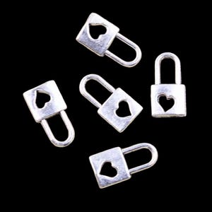 May include: Five silver heart-shaped padlocks with a keyhole on the side. The padlocks are scattered on a black background.