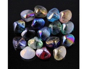 May include: Assortment of iridescent glass clam shell beads in various colors, including blue, green, purple, red, and white.