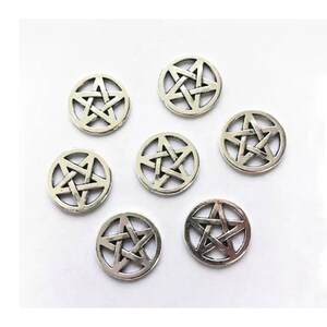 May include: Eight silver-toned metal charms featuring a pentagram design. Each charm is a circle with a five-pointed star inside.
