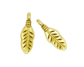 May include: Two gold-colored metal leaf-shaped charms with a textured surface.