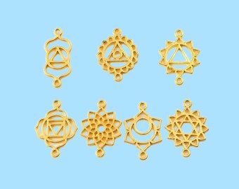 May include: Seven gold-colored metal charms featuring different chakra symbols. The charms are designed with intricate details and have two small loops for attaching to jewelry or other crafts.