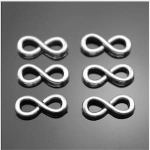 May include: Six silver infinity symbol charms. The charms are small and delicate, perfect for adding a touch of elegance to jewelry or crafts.